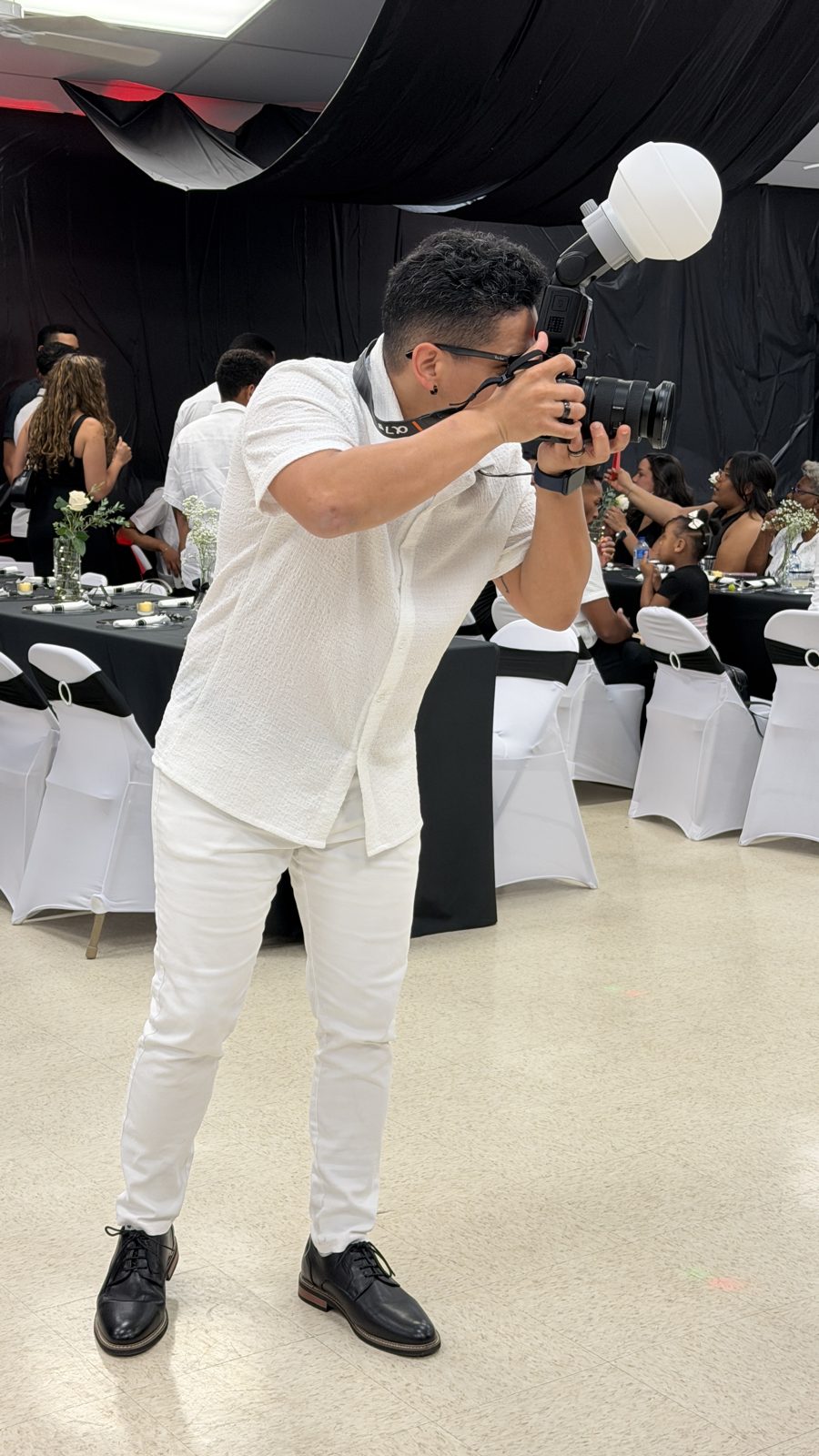 Jose Peralta of JPF Visual Studios photographing a wedding